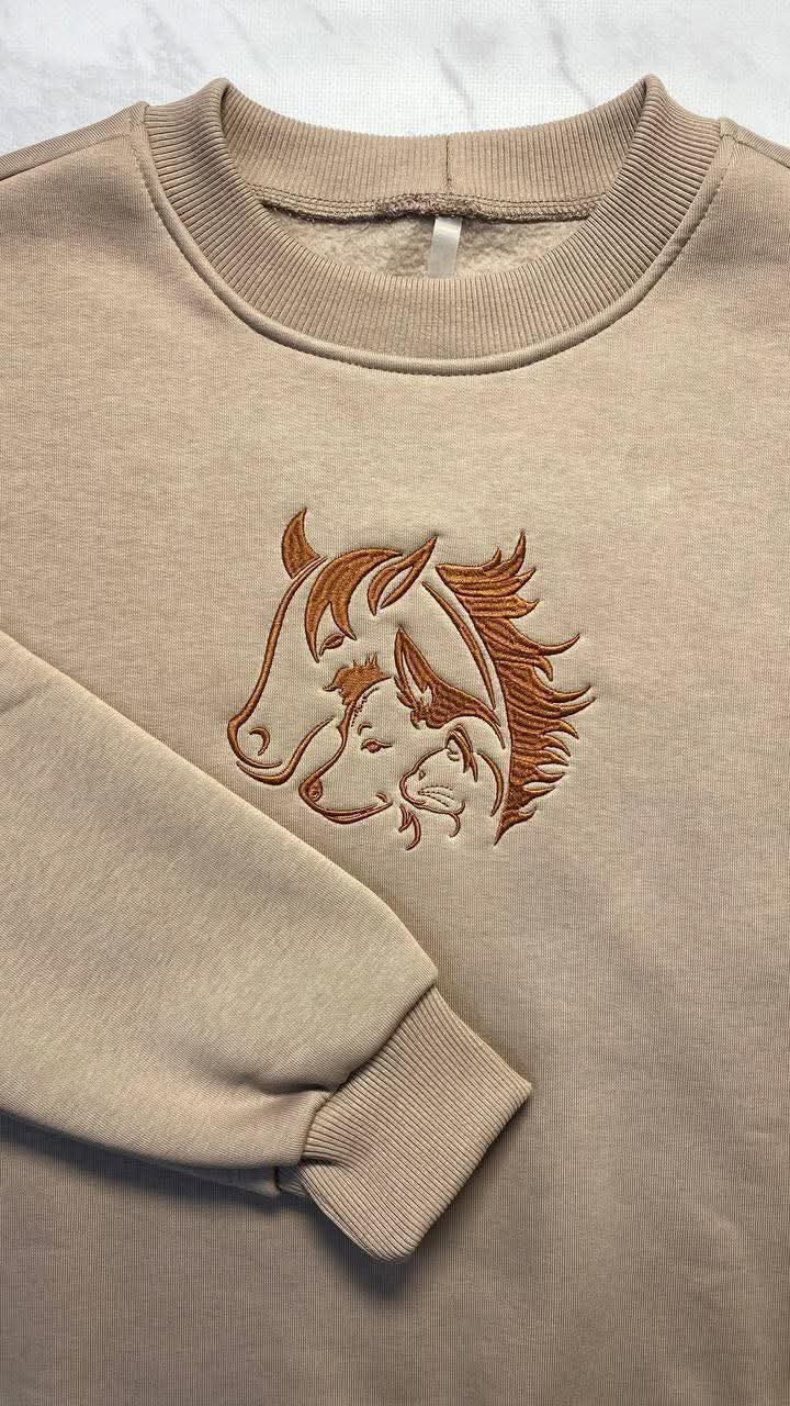 Embroidered long sleeve apparel detail
